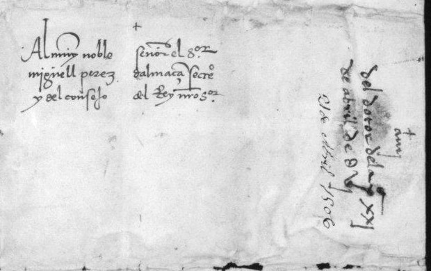 Same item, dorse (PARES image 4/4, cropped): address “Al muy noble señor el señor Miguell Perez d’Almaçan, secretario y del consejo del Rey nuestro señor” and receipt note “del dotor de la P., xxj de abril de dvj”. Ministerio de Cultura (España), Archivo General de Simancas.
